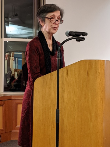 Moira Linehan: Image description - A woman standing at a podium.